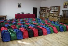 Arhiepiscopia Dunării de Jos continuă sprijinirea elevilor cu ghiozdane şi rechizite şcolare
